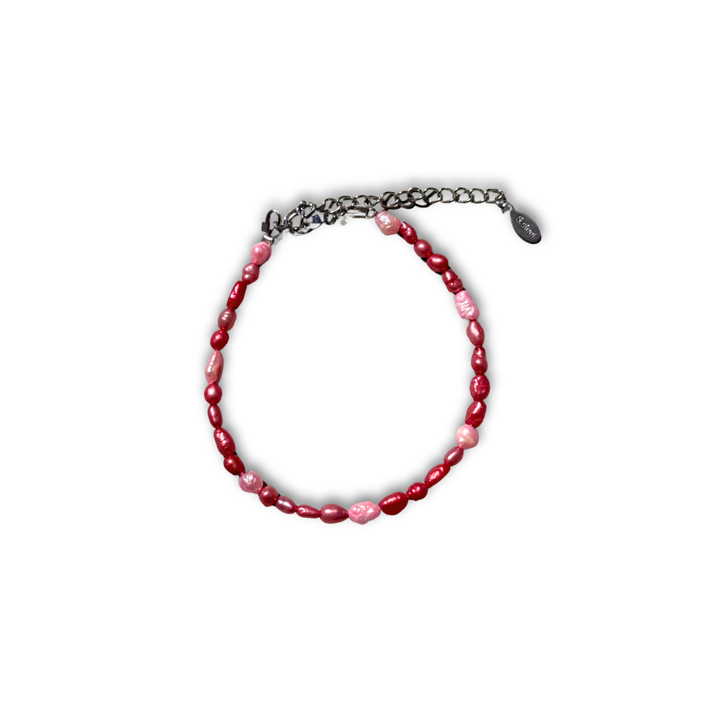 Eros pearl bracelet worn on a wrist – Feminine Creatures
