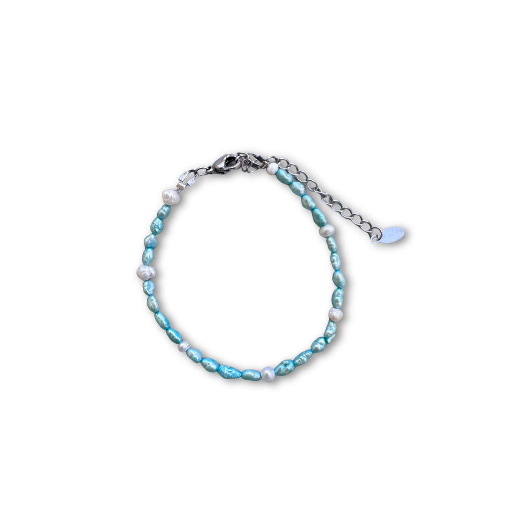 Turquoise Tide bracelet worn on a wrist – Feminine Creatures